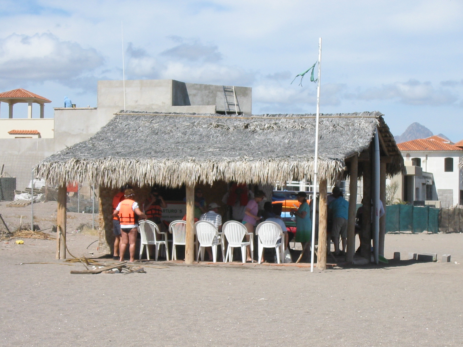 The local office of Arturo's Sport Fishing. This picture shows passengers from a visiting cruise ship assembling for a tour.