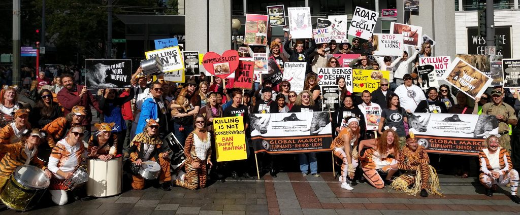 Marchers for Rhinos and Elephants, posing at Westlake Center.
